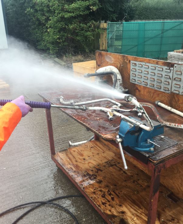 High Pressure Water Jet Cleaning of an Industrial Pipe with a combination of bends